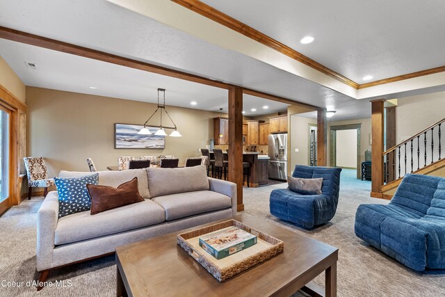 living area featuring visible vents, ornamental molding, stairway, recessed lighting, and light carpet