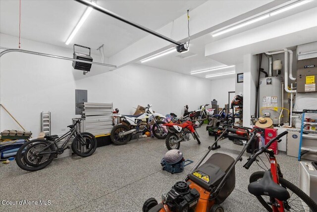 garage featuring gas water heater and a garage door opener