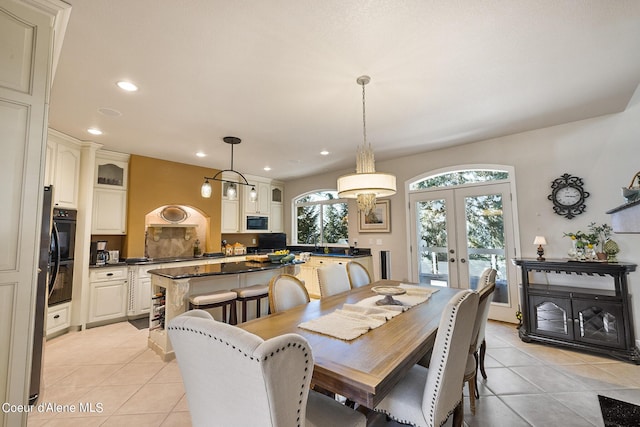 dining area with recessed lighting, french doors, and light tile patterned floors