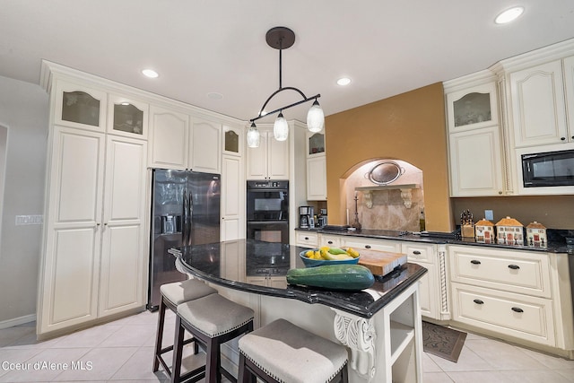 kitchen featuring glass insert cabinets, black appliances, dark countertops, and light tile patterned floors