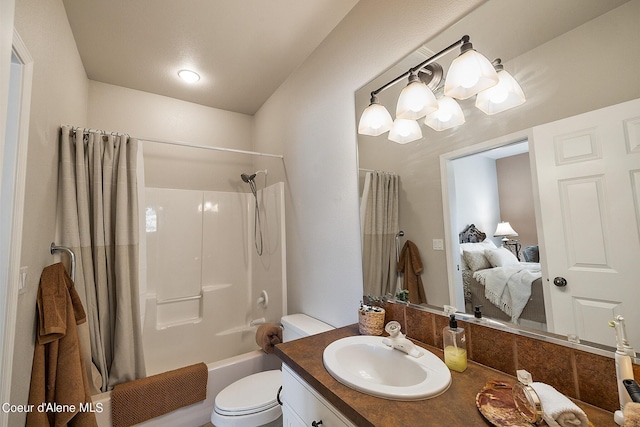 ensuite bathroom with ensuite bathroom, toilet, vanity, and shower / bath combo with shower curtain