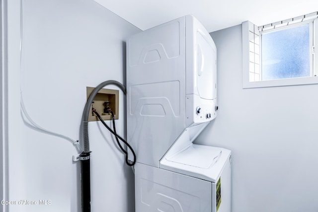 washroom with stacked washer and dryer