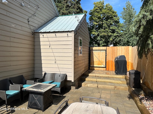 view of patio featuring a grill