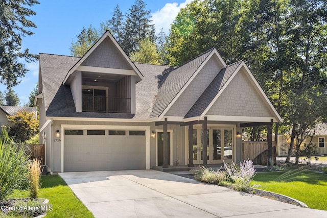 craftsman house with a garage and a front yard