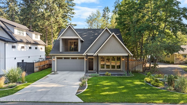 view of front of house featuring a garage and a front yard