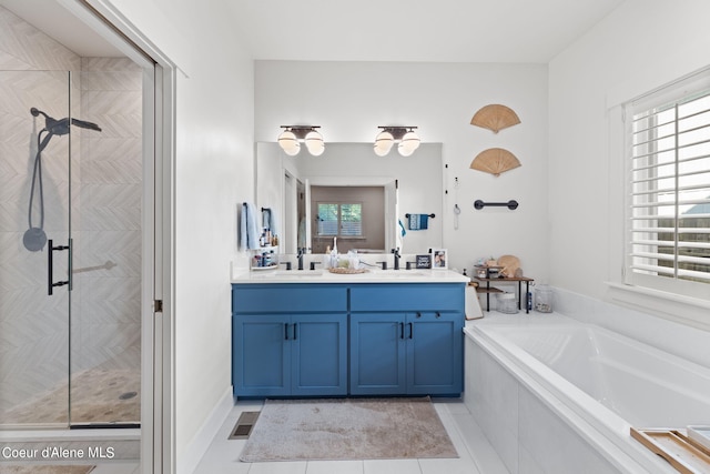 bathroom featuring tile patterned floors, separate shower and tub, and vanity