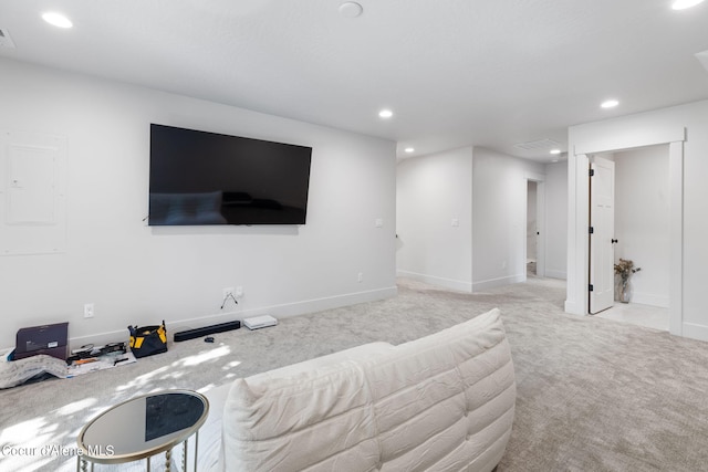 carpeted living room with electric panel