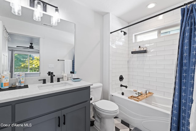 full bathroom featuring tile patterned floors, toilet, shower / tub combo, ceiling fan, and vanity