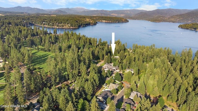 aerial view featuring a water and mountain view