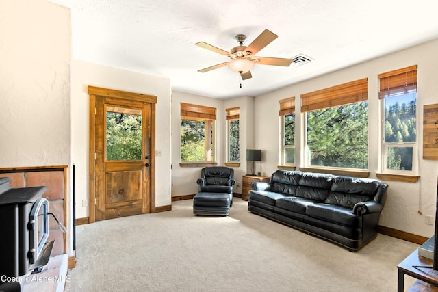 living room with ceiling fan and light carpet