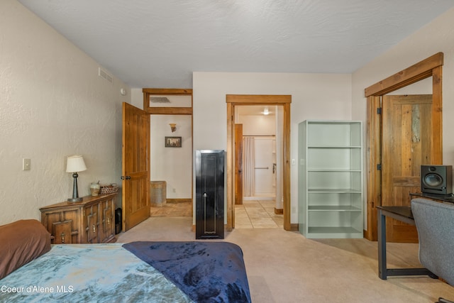 carpeted bedroom with a textured ceiling