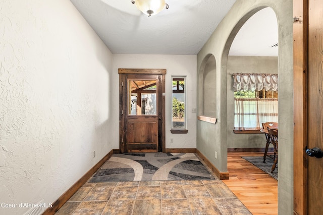 entrance foyer featuring hardwood / wood-style floors