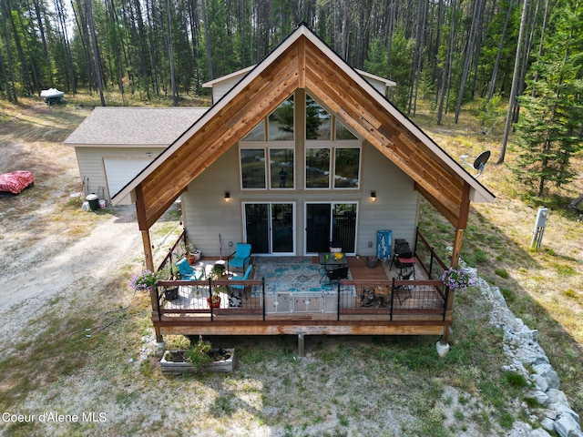 back of property with a wooden deck