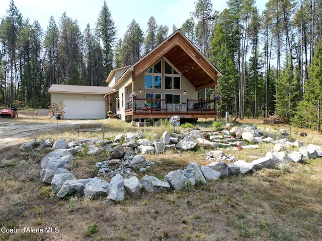 view of front of house with a garage and a deck