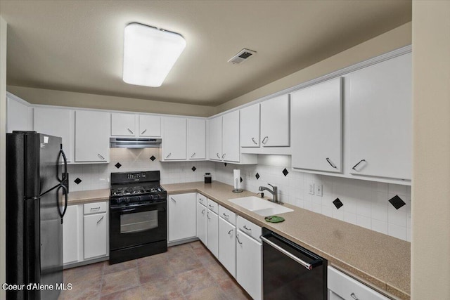 kitchen with black appliances, decorative backsplash, white cabinetry, and sink