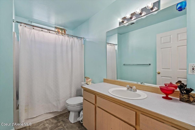 full bathroom with vanity, toilet, and shower / bath combo with shower curtain