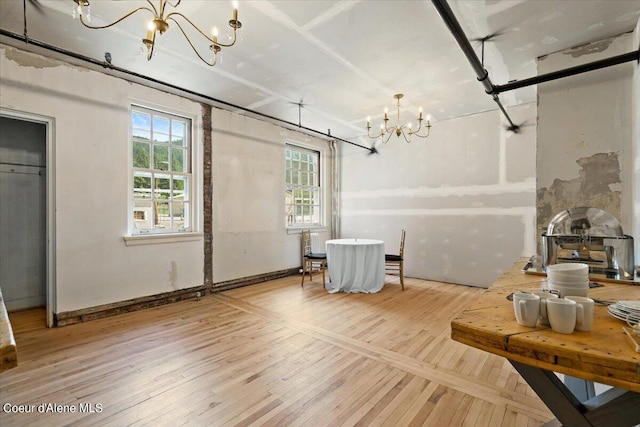 interior space with wood-type flooring and a chandelier