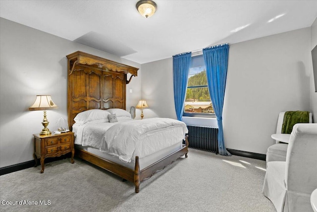 carpeted bedroom with radiator