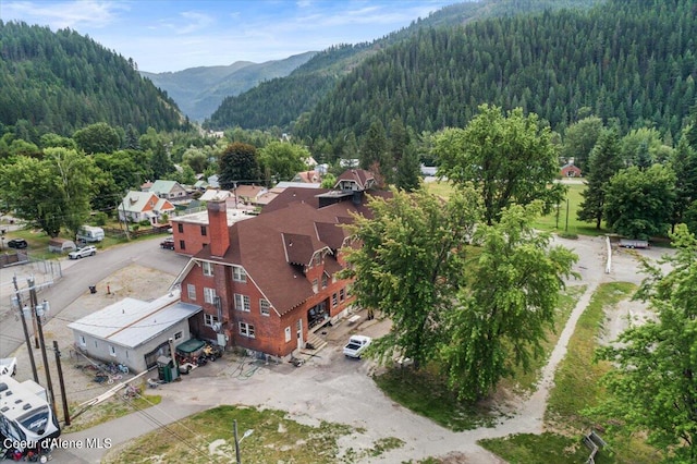 birds eye view of property with a mountain view