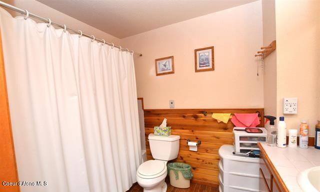 169 Westfall Ln, Kamiah, ID 83536 - bathroom with toilet, vanity, and a shower with curtain