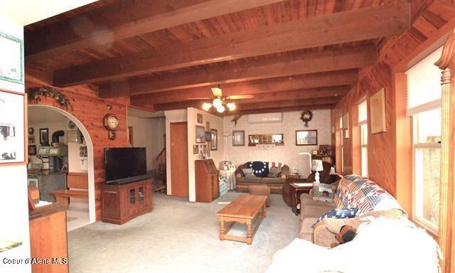 169 Westfall Ln, Kamiah, ID 83536 - living area featuring beamed ceiling, carpet, and wood ceiling