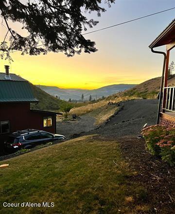 169 Westfall Ln, Kamiah, ID 83536 - yard at dusk with a mountain view