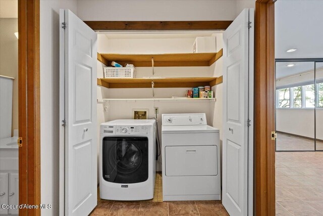 washroom featuring washing machine and dryer