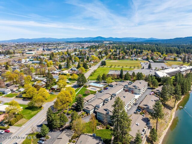 aerial view featuring a water and mountain view