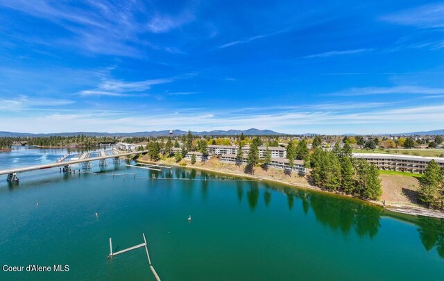 aerial view featuring a water and mountain view