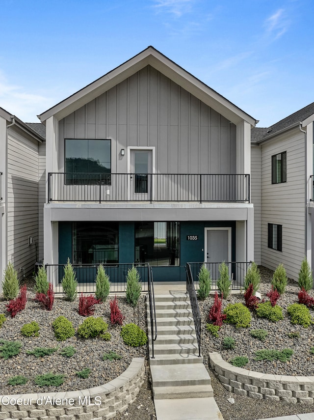 view of front facade featuring a balcony and covered porch