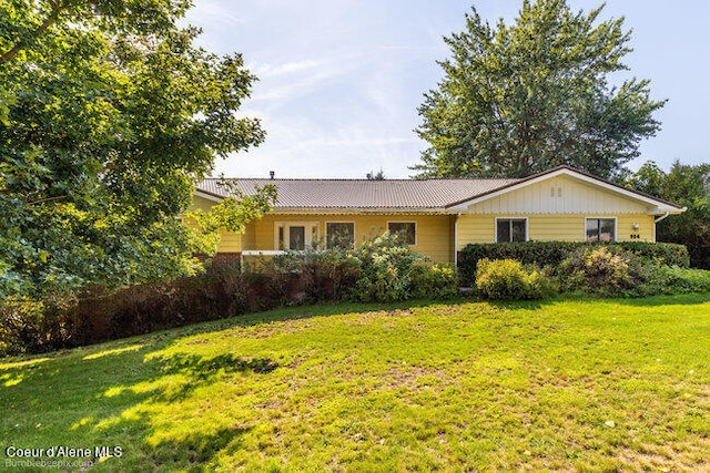 view of front of home with a front yard