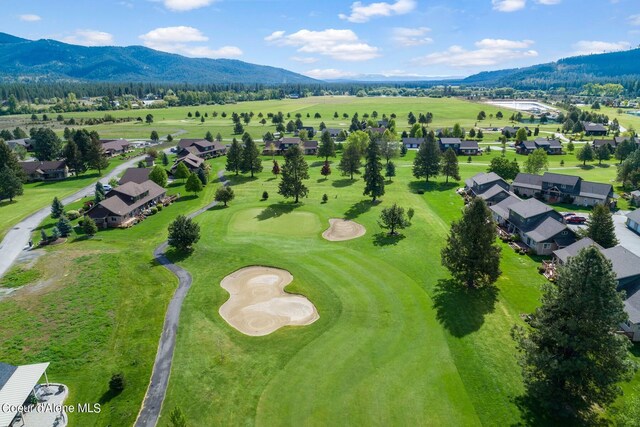 birds eye view of property with a mountain view