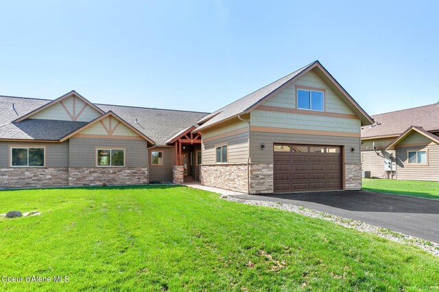 view of front facade featuring a garage and a front yard