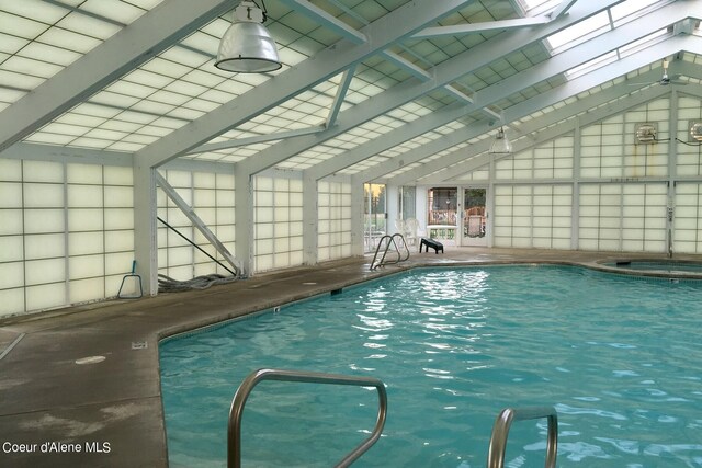 view of pool featuring a skylight