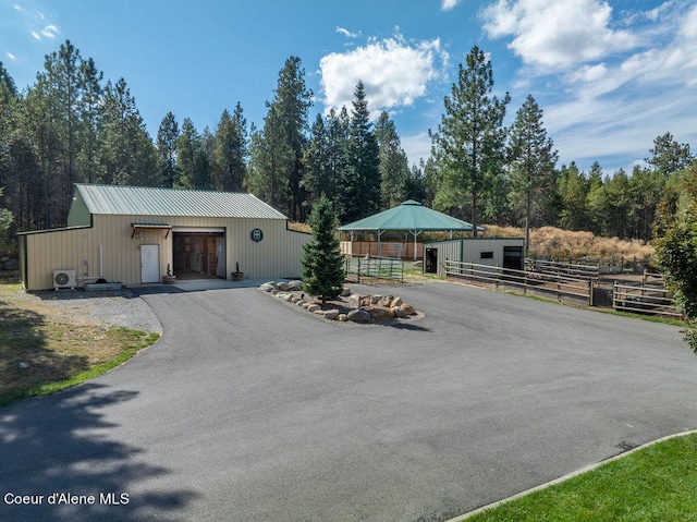 view of front of home with an outbuilding and a garage