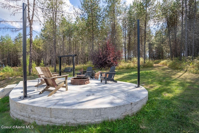 view of patio / terrace featuring a fire pit