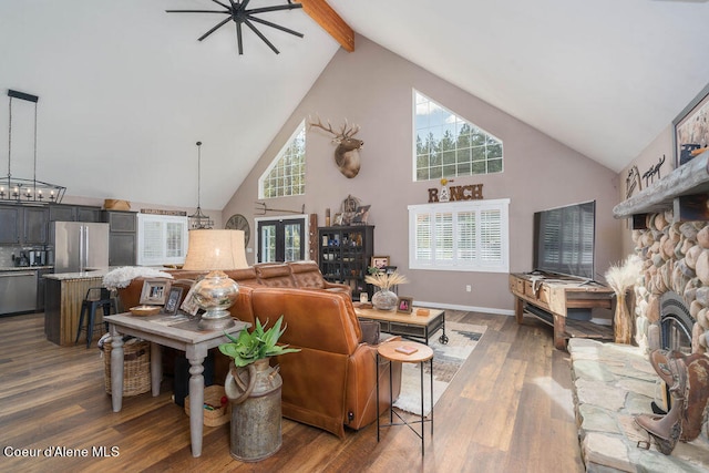 living room with ceiling fan, a fireplace, dark hardwood / wood-style flooring, and high vaulted ceiling