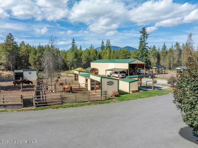 view of yard with a mountain view and an outdoor structure