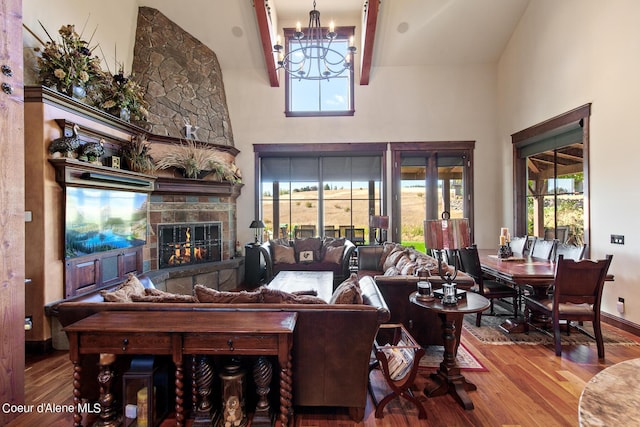 17023 S Citrine Dr, Coeur Dalene, ID 83814 - living room with a wealth of natural light, wood finished floors, and an inviting chandelier