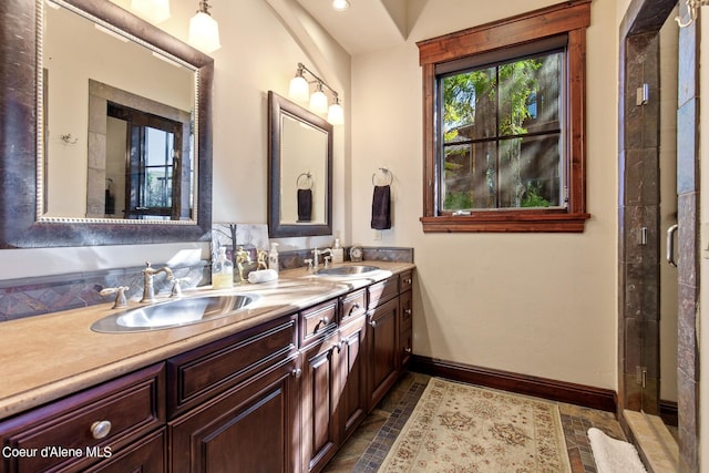 17023 S Citrine Dr, Coeur Dalene, ID 83814 - full bathroom featuring baseboards, double vanity, a sink, and a tile shower