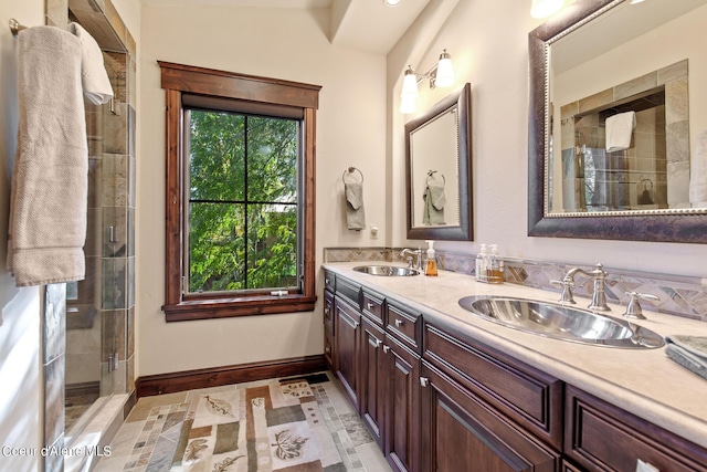 17023 S Citrine Dr, Coeur Dalene, ID 83814 - full bathroom featuring double vanity, a sink, a stall shower, and baseboards