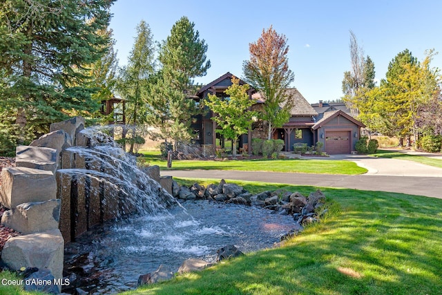 17023 S Citrine Dr, Coeur Dalene, ID 83814 - view of front facade with concrete driveway, a garage, and a front lawn