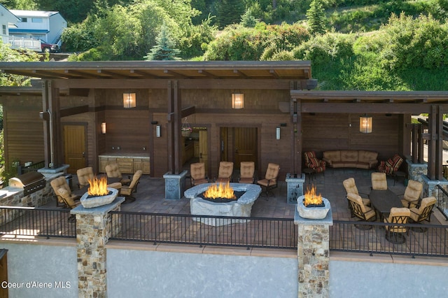 17023 S Citrine Dr, Coeur Dalene, ID 83814 - view of patio / terrace featuring a fire pit