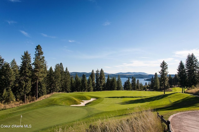 17023 S Citrine Dr, Coeur Dalene, ID 83814 - view of property's community featuring view of golf course, a mountain view, and a lawn
