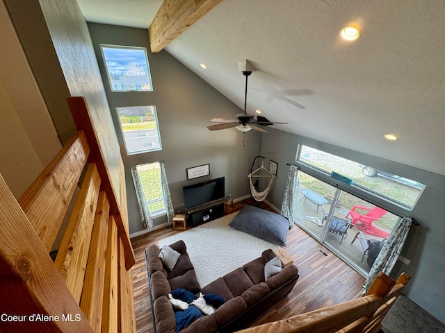 living room with wood-type flooring, high vaulted ceiling, ceiling fan, and beam ceiling