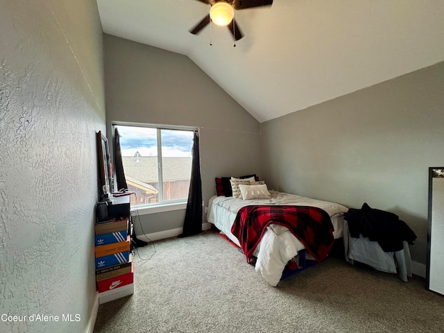 carpeted bedroom featuring ceiling fan and vaulted ceiling