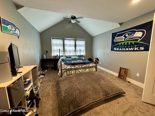 carpeted bedroom featuring ceiling fan and vaulted ceiling