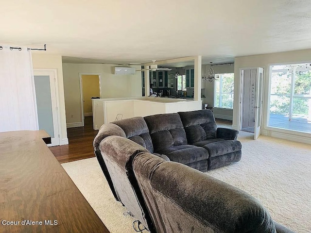 living room with a chandelier and hardwood / wood-style flooring