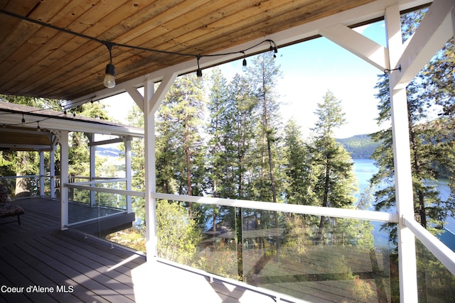 wooden deck featuring a water view