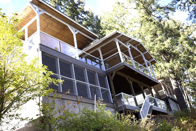 view of property exterior with a balcony